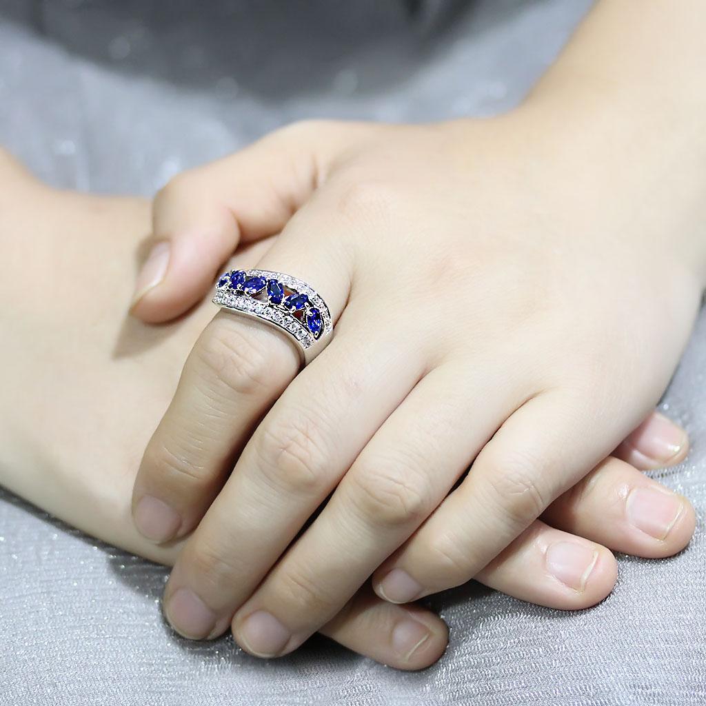 3W1569 Rhodium Brass Ring featuring a London Blue Synthetic Spinel, showcasing its elegant design and vibrant color.