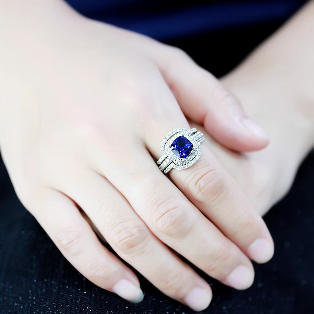 3W1599 Rhodium Brass Ring featuring a vibrant London Blue Synthetic Spinel, showcasing its elegant design and quality craftsmanship.