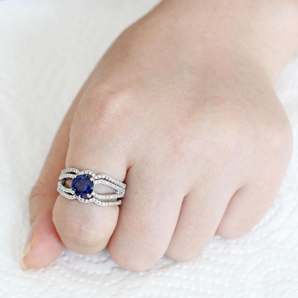 3W1597 Rhodium Brass Ring featuring AAA Grade CZ in London Blue, showcasing its elegant design and sparkling center stone.