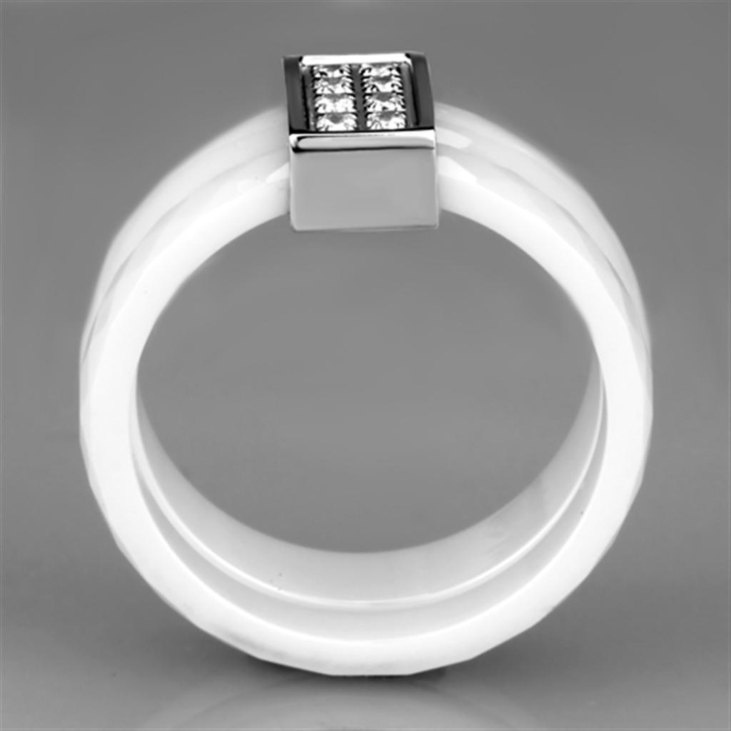 High polished stainless steel ring featuring a white ceramic center stone, showcasing elegance and durability.
