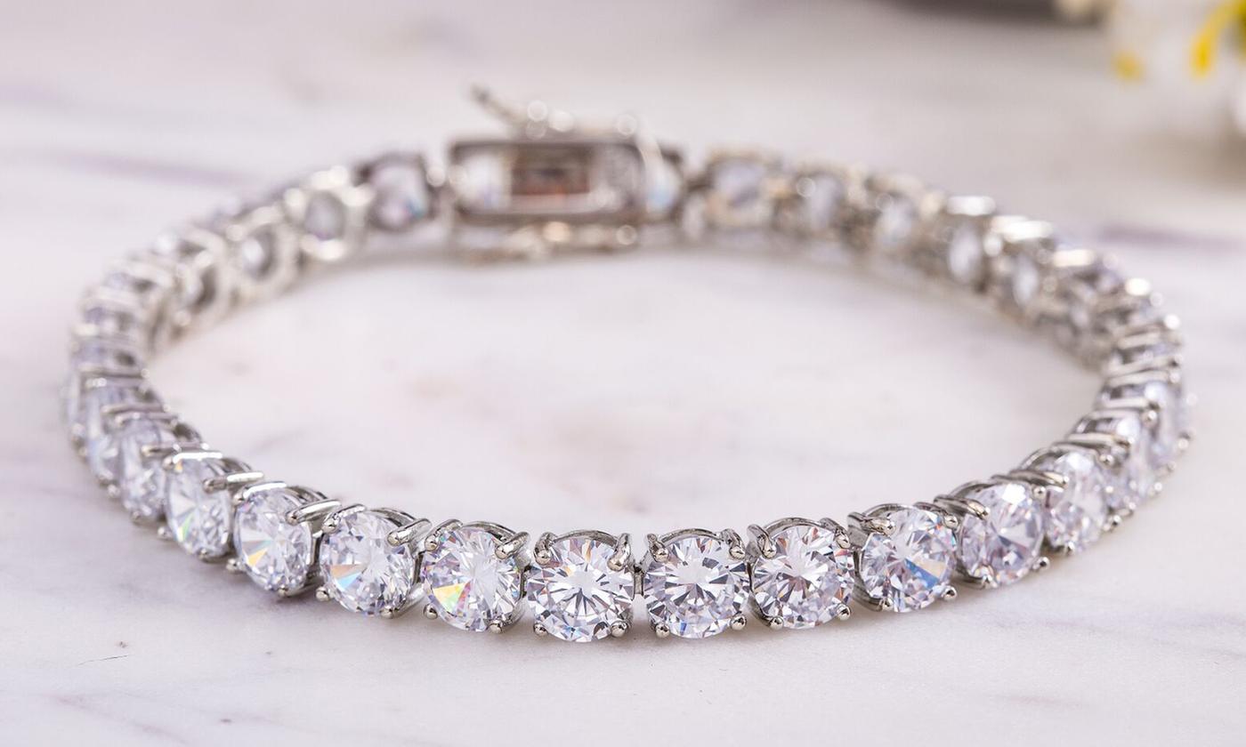 A stunning 42.00 CTTW tennis bracelet featuring AAA-quality Austrian crystals set in 18K white gold plating, elegantly designed in Italy.