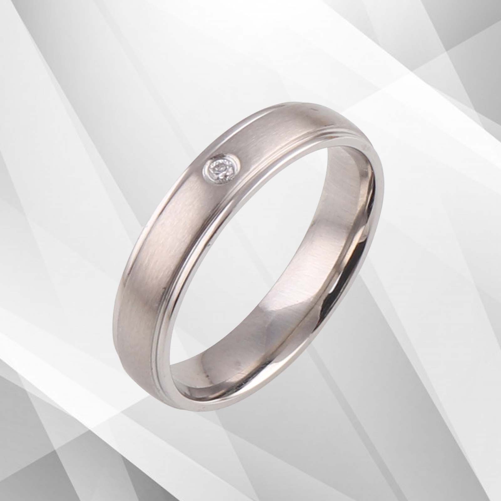 4mm wide 18Ct white gold over 0.35Ct CZ diamond engagement ring with a matt finish titanium band.