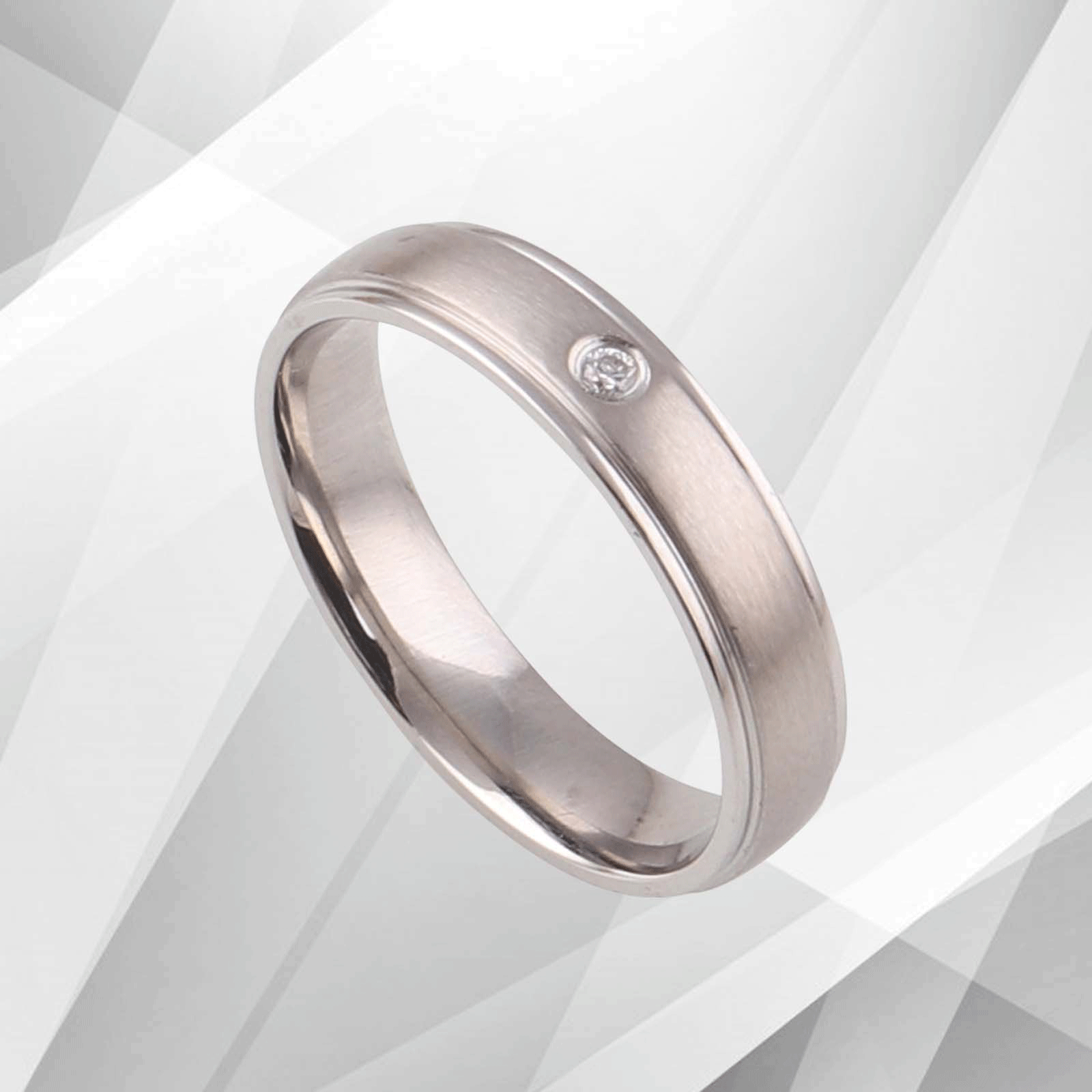 4mm wide 18Ct white gold over 0.35Ct CZ diamond engagement ring with a matt finish titanium band.