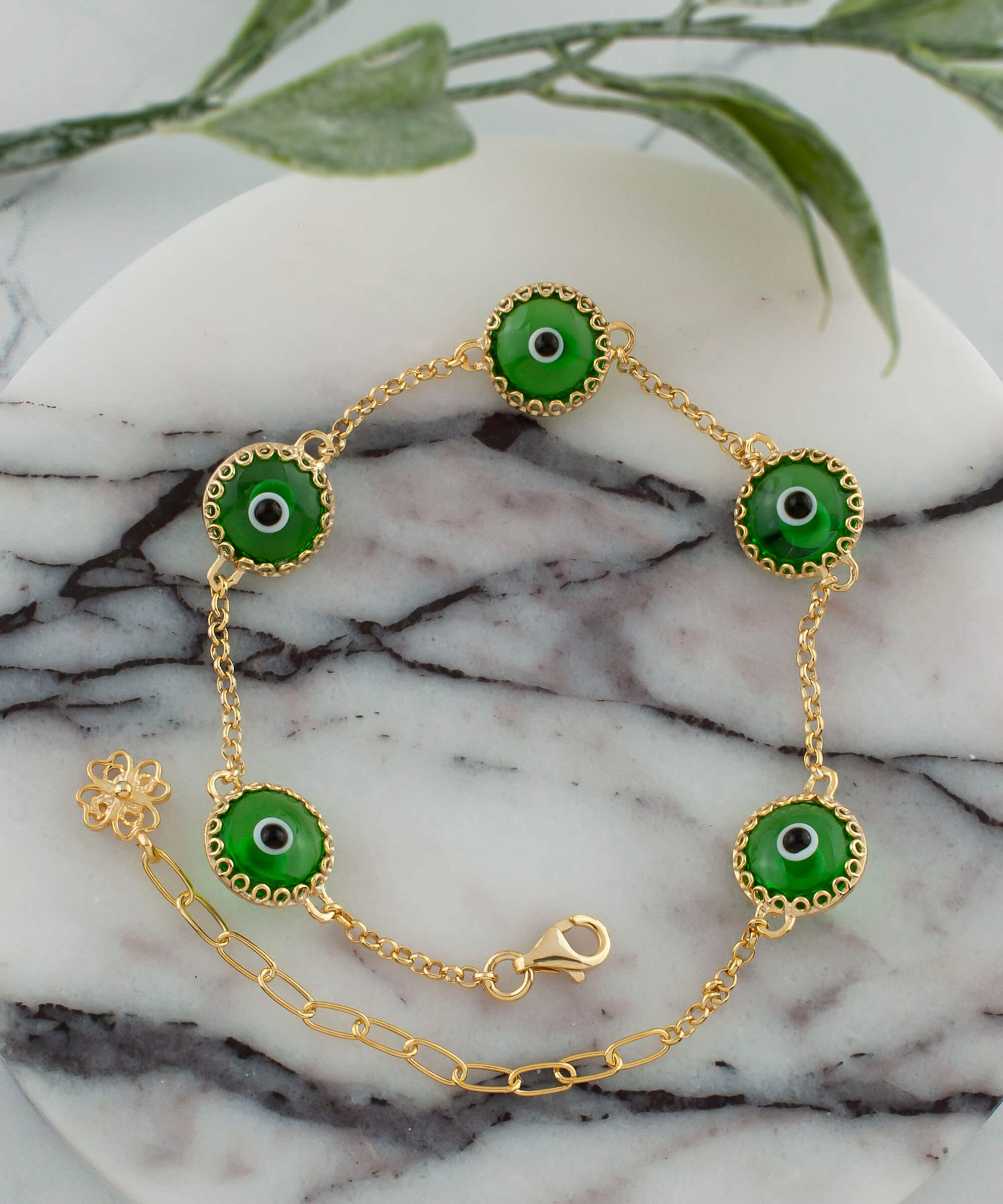 Mint green evil eye bracelet featuring five beads on a gold plated sterling silver link chain, secured with a lobster claw clasp.