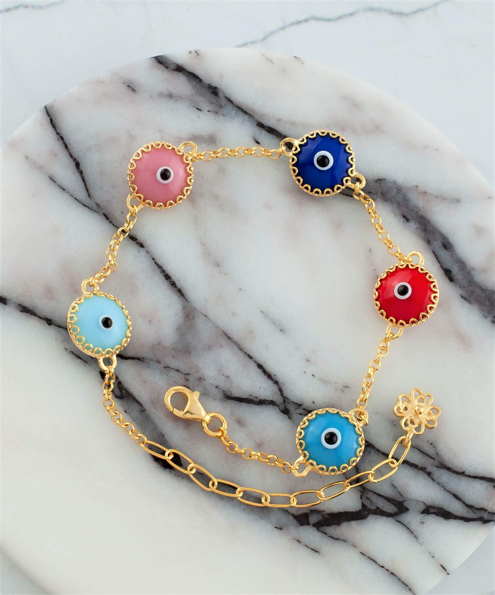 A stylish gold plated sterling silver link bracelet featuring five colorful evil eye beads, designed for women.
