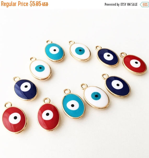Five gold plated evil eye charms featuring blue Turkish design, available in four colors.