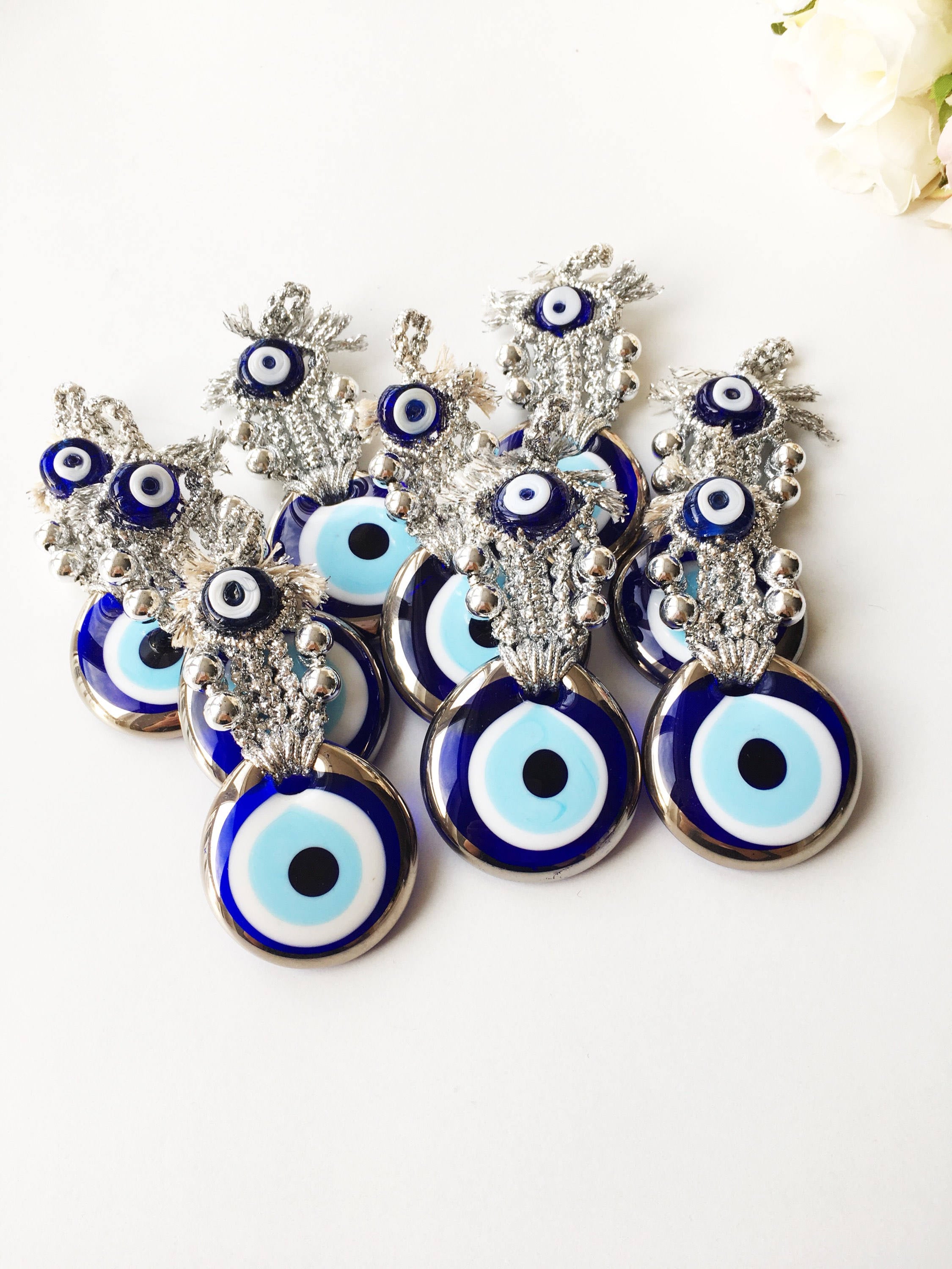 Set of 5 handmade evil eye wedding favors in gold and silver, featuring nazar boncuk charms, perfect for guest gifting.