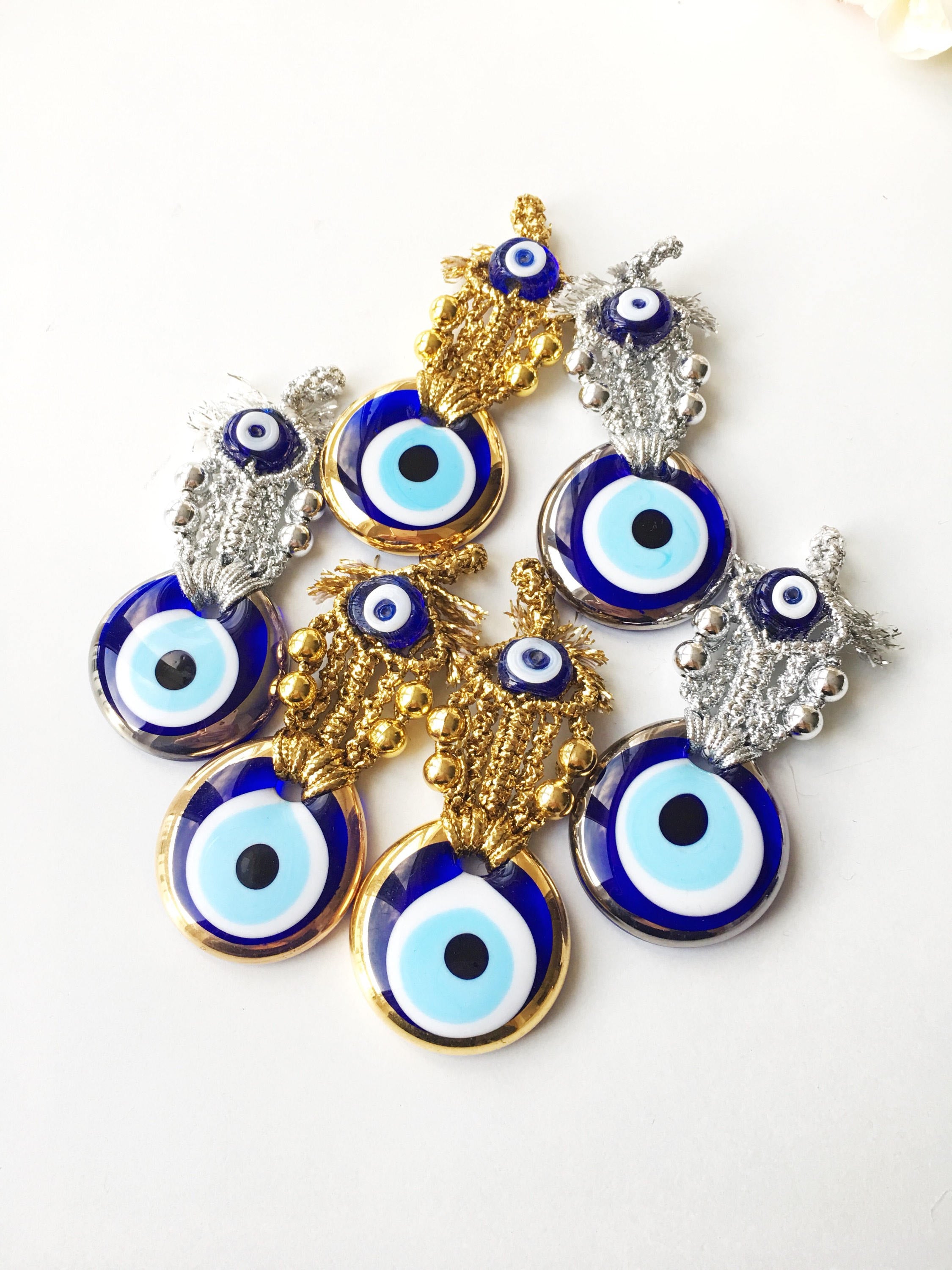 Set of 5 handmade evil eye wedding favors in gold and silver, featuring nazar boncuk charms, perfect for guest gifting.
