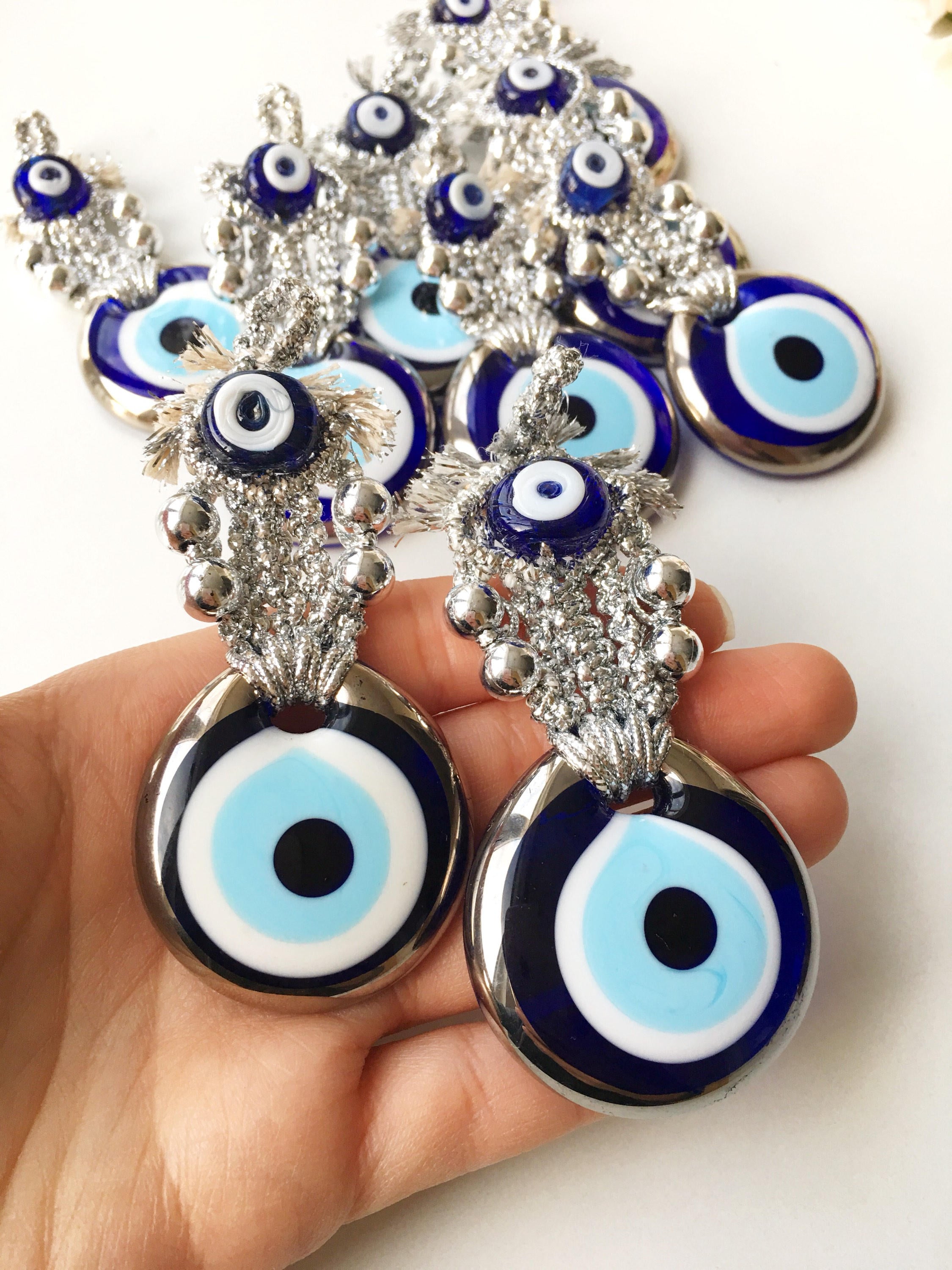 Set of 5 handmade evil eye wedding favors in gold and silver, featuring nazar boncuk charms, perfect for guest gifting.