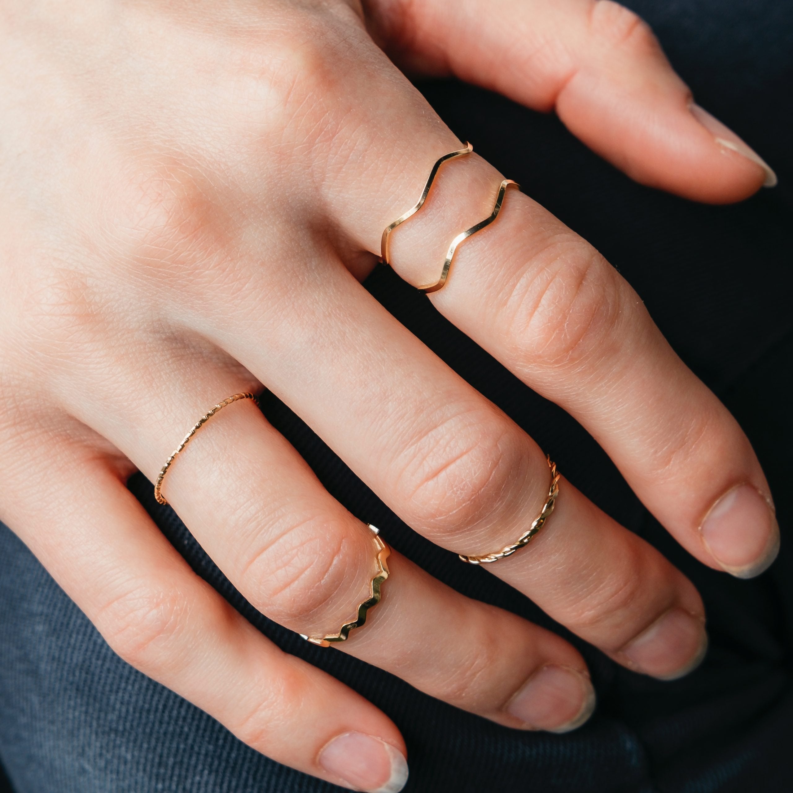 5 Piece Slim Silver Bohemian Pearl Tribal Midi Stackable Ring Set displayed elegantly, showcasing their minimalist design and high-quality finish.