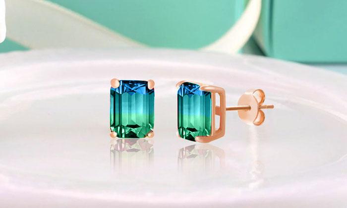 Elegant 5.00 Ctw Emerald Cut Sapphire/Aquamarine Stud Earrings in 18K Rose Gold, showcasing their stunning design and craftsmanship.