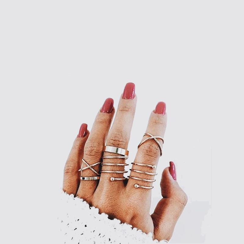 A stylish 6 piece geometric ring set made of 18K gold plated jewelry, showcasing unique designs and a luxurious finish.