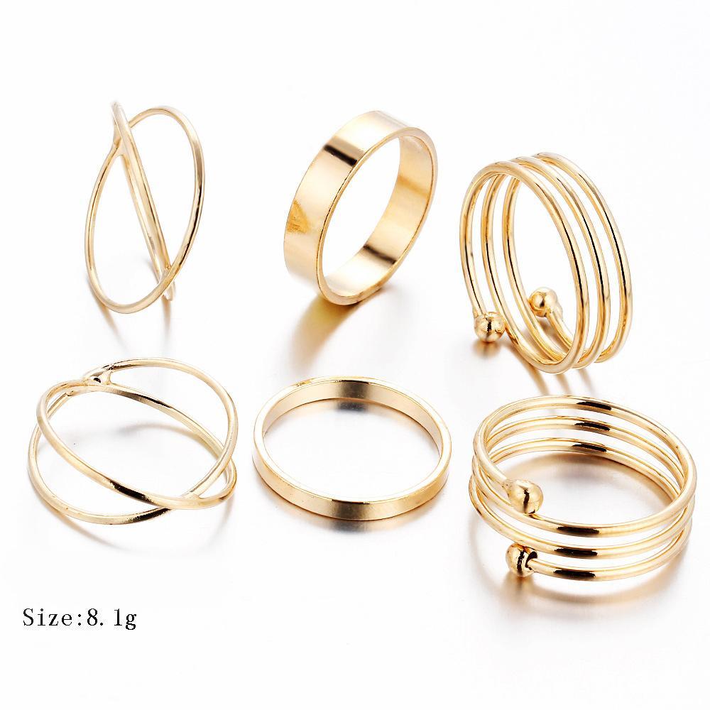 A stylish 6 piece geometric ring set made of 18K gold plated jewelry, showcasing unique designs and a luxurious finish.