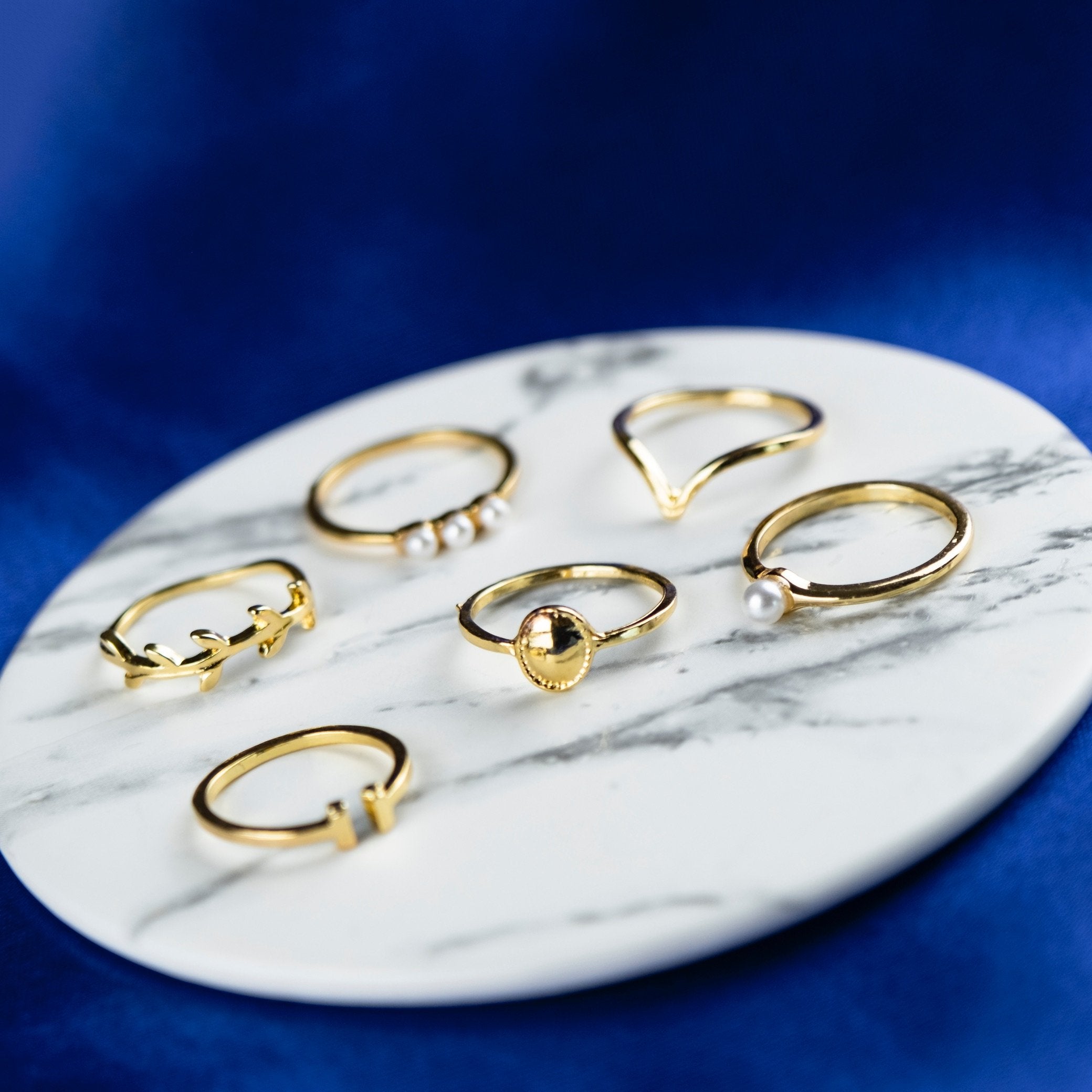 A beautiful 6 Piece Gold Plated Oxidised Bohemian Vintage Tribal Ring Set showcasing intricate tribal designs and a lustrous gold finish.