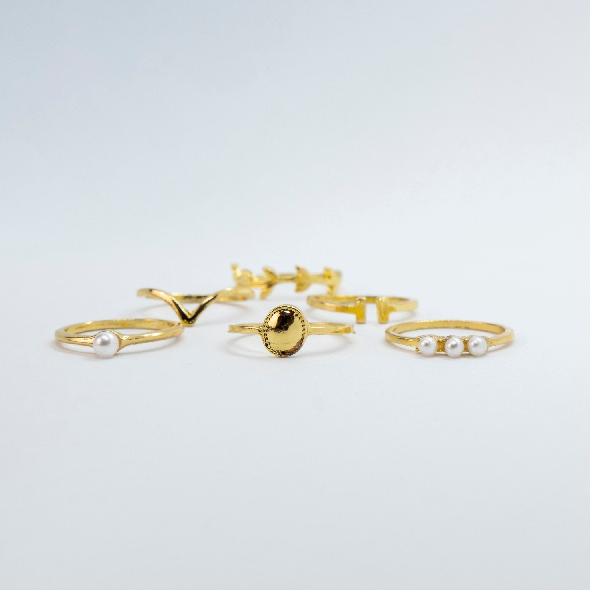 A beautiful 6 Piece Gold Plated Oxidised Bohemian Vintage Tribal Ring Set showcasing intricate tribal designs and a lustrous gold finish.