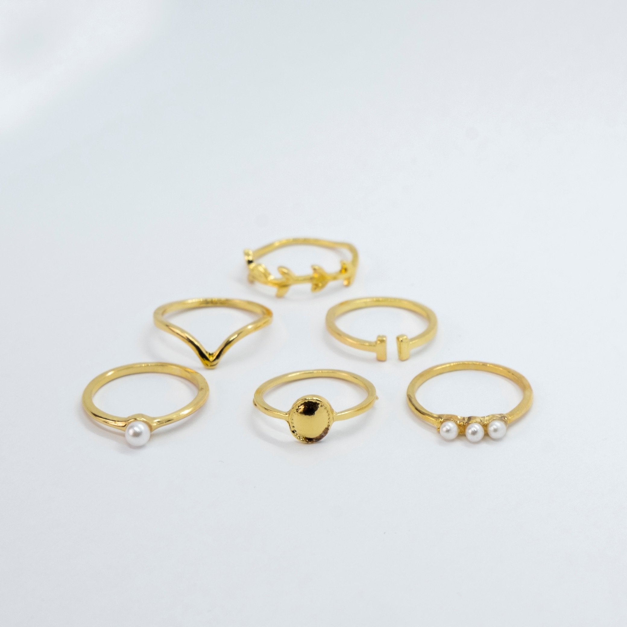 A beautiful 6 Piece Gold Plated Oxidised Bohemian Vintage Tribal Ring Set showcasing intricate tribal designs and a lustrous gold finish.