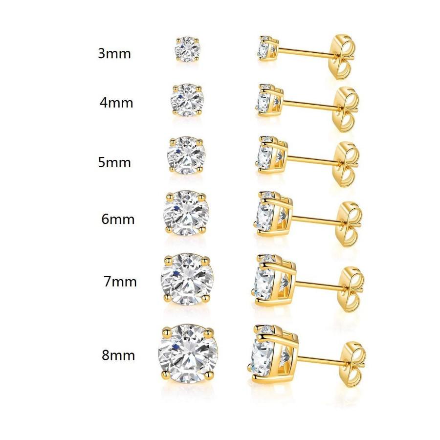 A set of six graduating classic stud earrings in 14K gold plating with white princess cut stones, elegantly displayed.
