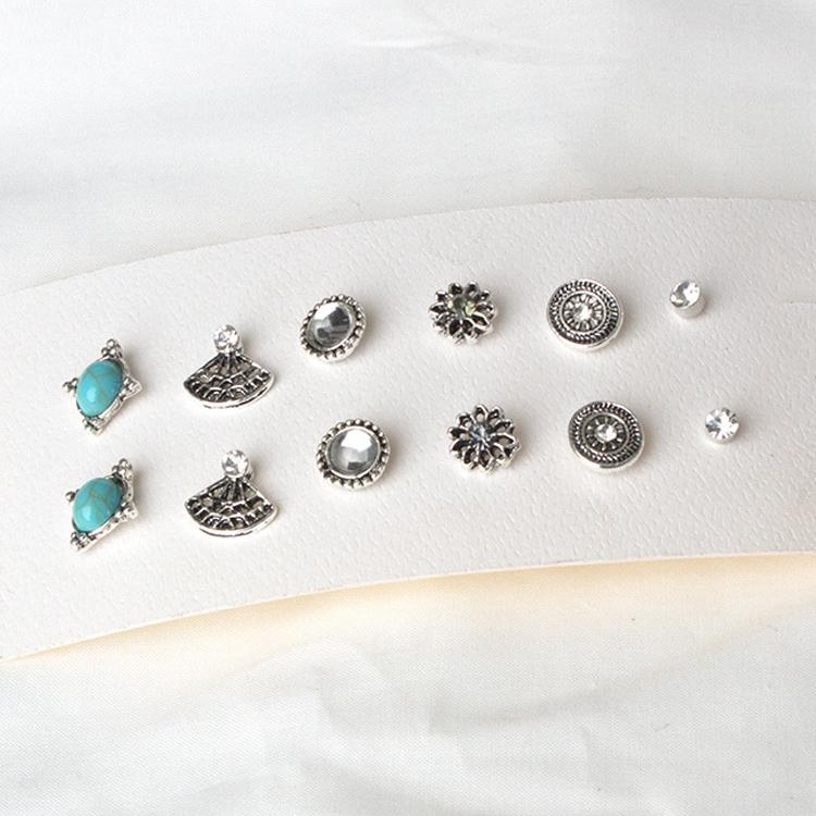 A beautiful set of 6 piece stud earrings made of 18K white gold, showcasing their elegant design and shine.