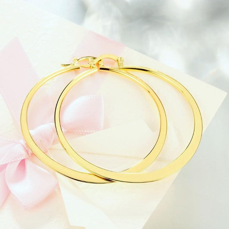 A pair of elegant 60mm 18K gold plated hoop earrings with a shiny finish, showcasing Italian design and craftsmanship.