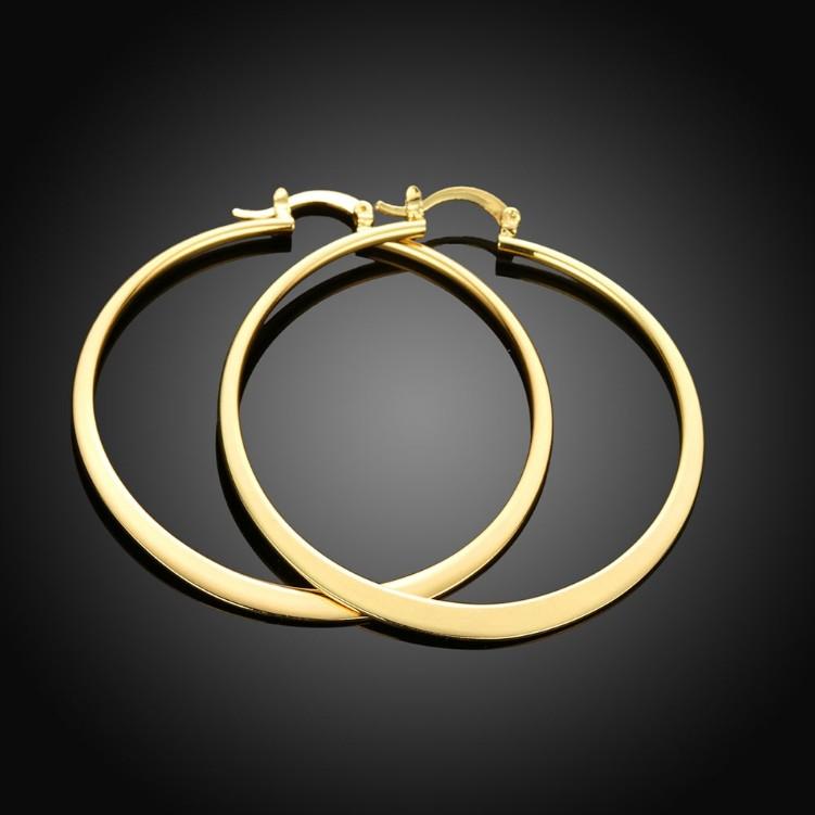 A pair of elegant 60mm 18K gold plated hoop earrings with a shiny finish, showcasing Italian design and craftsmanship.