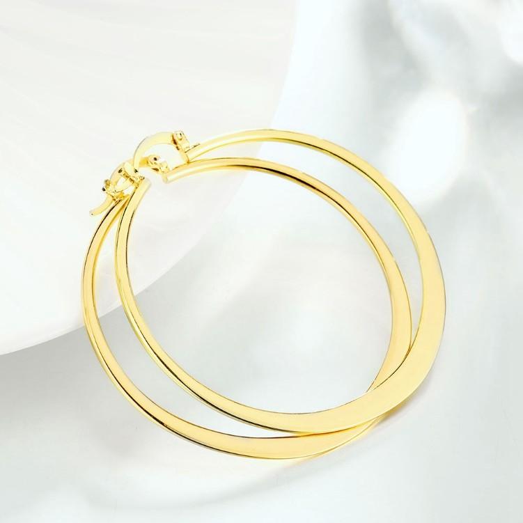 A pair of elegant 60mm 18K gold plated hoop earrings with a shiny finish, showcasing Italian design and craftsmanship.