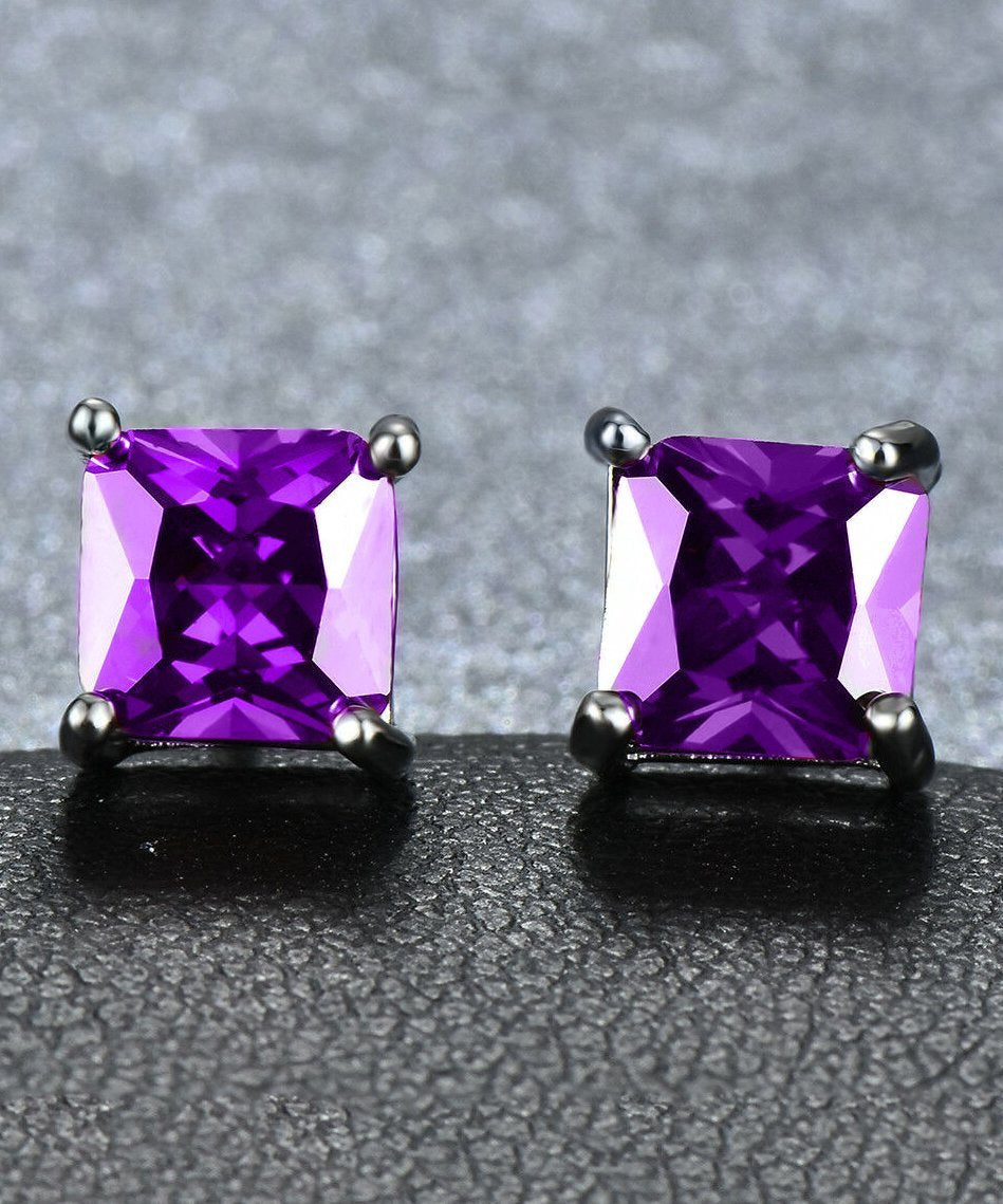 Elegant 6mm princess stud earrings with purple Austrian crystals set in 18K white gold, showcasing a timeless design.