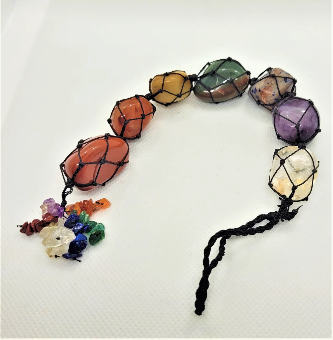 A beautifully crafted 7 Chakra Gemstone Dream Catcher Wall Hanging featuring seven unique gemstones, symbolizing healing and prosperity.