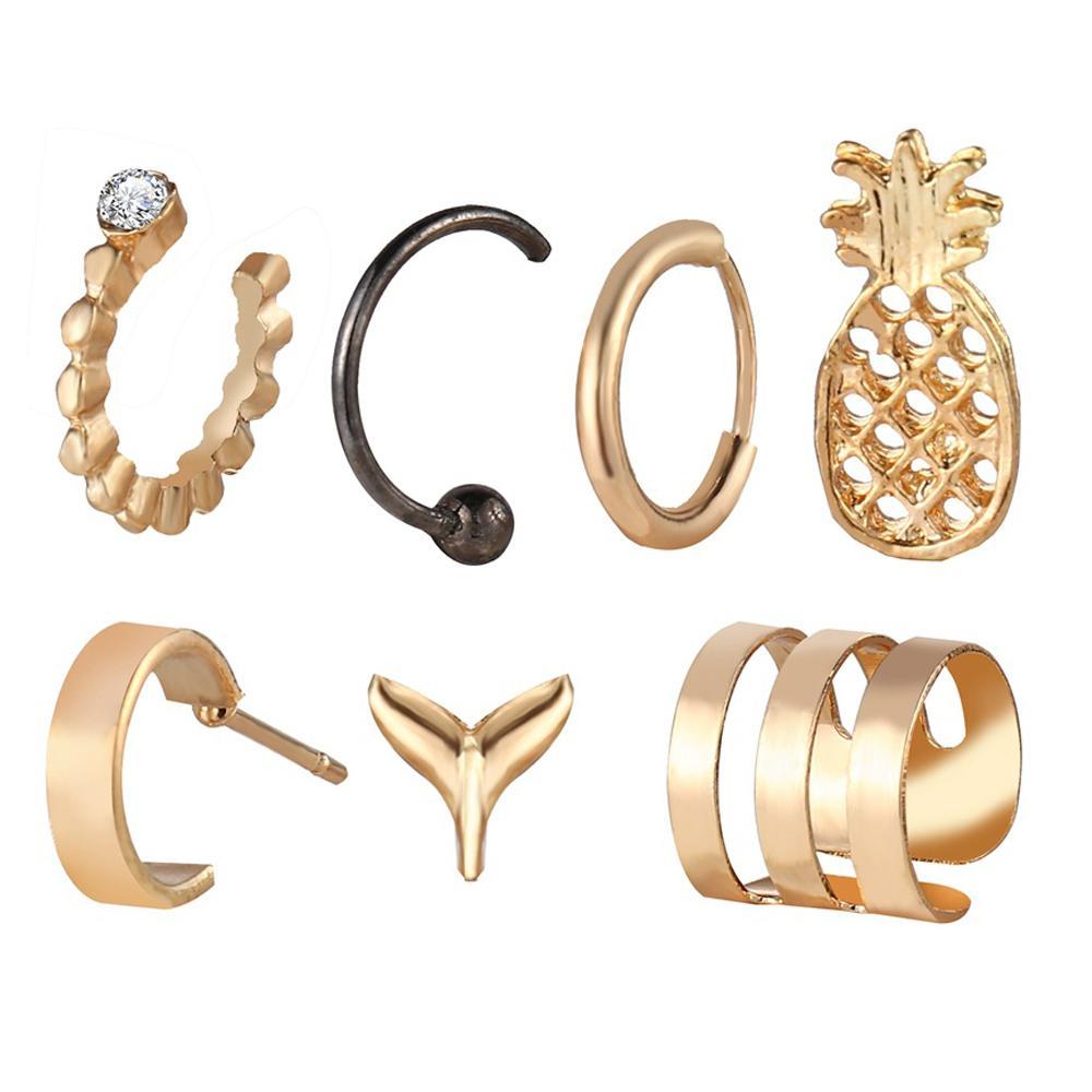 A beautiful 7 piece earring set featuring various styles, all crafted in 18K gold plating, showcasing Italian craftsmanship.