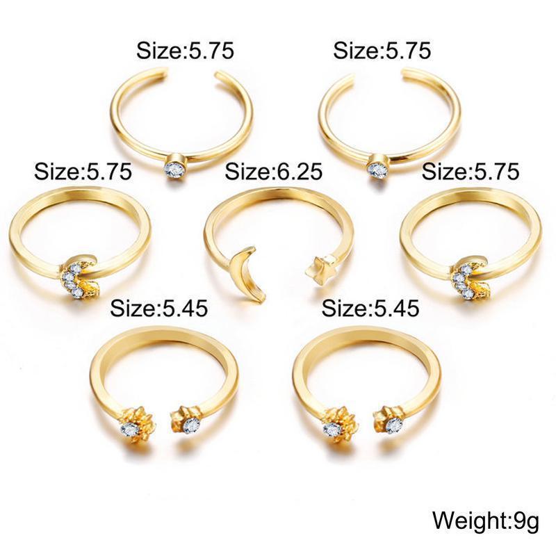 A beautiful 7 piece ring set featuring moon and stars designs, adorned with sparkling gemstone crystals, plated in 18K gold.