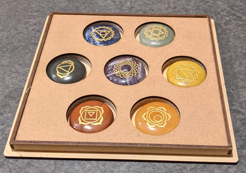 7 Stone Chakra Set Palm Stones with engraved symbols, beautifully polished and presented in a box, ideal for meditation and healing.