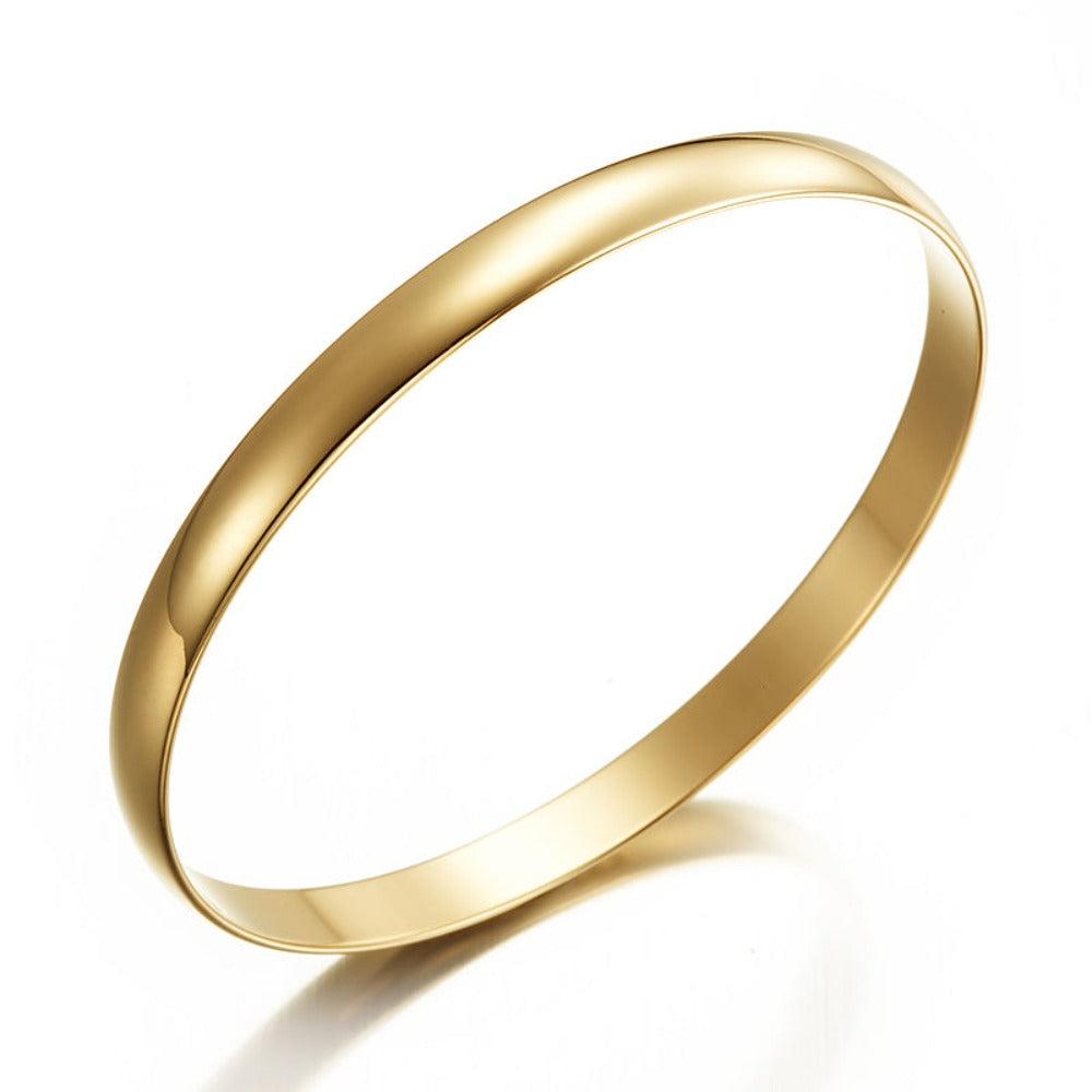 A 7mm wide 18ct heavy yellow gold plated plain bangle, showcasing its elegant design and luxurious finish, made in the USA.