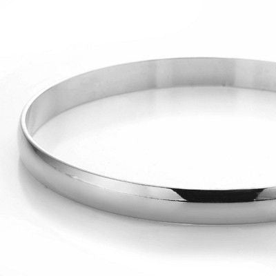 A 7mm wide plain bangle made of 925 sterling silver plating, showcasing its elegant design and shiny finish, perfect for any occasion.