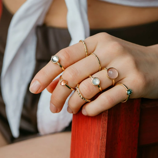 A vibrant set of 8 metallic boho rings in silver and gold, showcasing intricate designs and colorful stones, perfect for stacking.