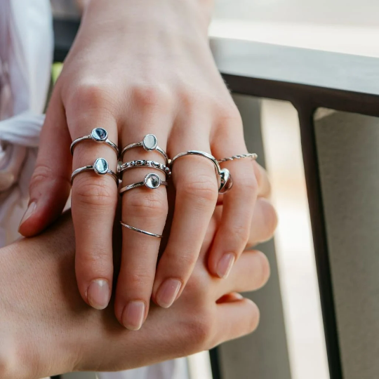 A vibrant set of 8 metallic boho rings in silver and gold, showcasing intricate designs and colorful stones, perfect for stacking.