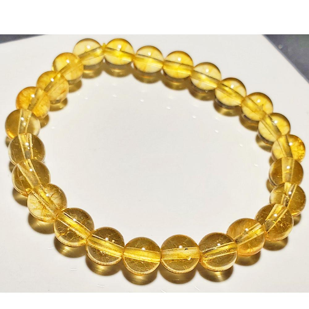 A handmade 8mm citrine beaded elastic stretch bracelet featuring smooth round beads in a vibrant yellow color, perfect for everyday wear.
