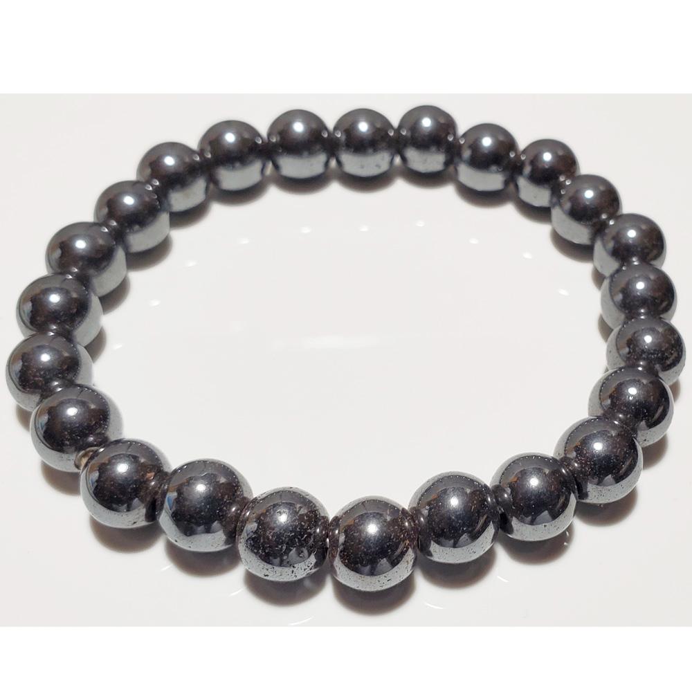 A stylish 8mm hematite beaded elastic stretch bracelet with smooth round beads, perfect for everyday wear and chakra healing.