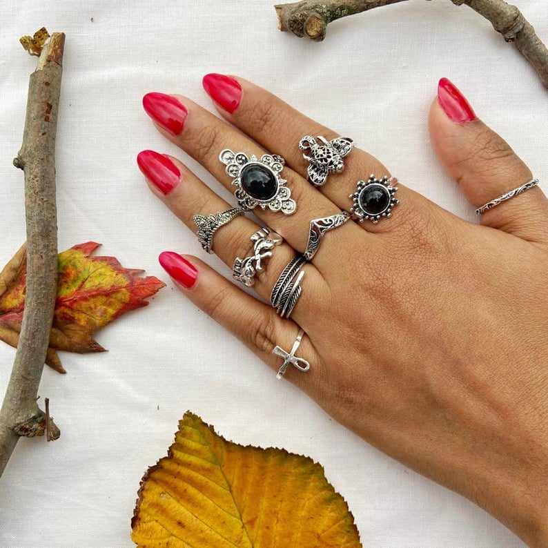 A stylish 9 piece bohemian stackable beach midi tribal vintage ring set featuring elegant silver rings with unique designs.