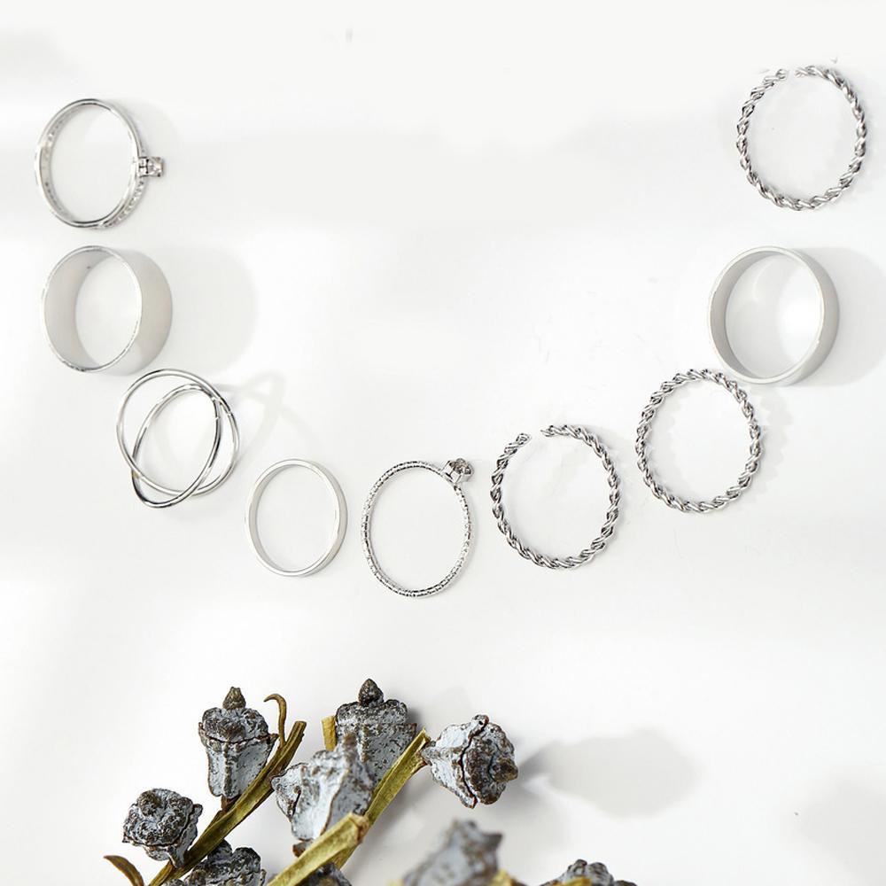 9 Piece Twist Geo Ring Set featuring elegant 18K white gold plating, showcasing unique twist designs.