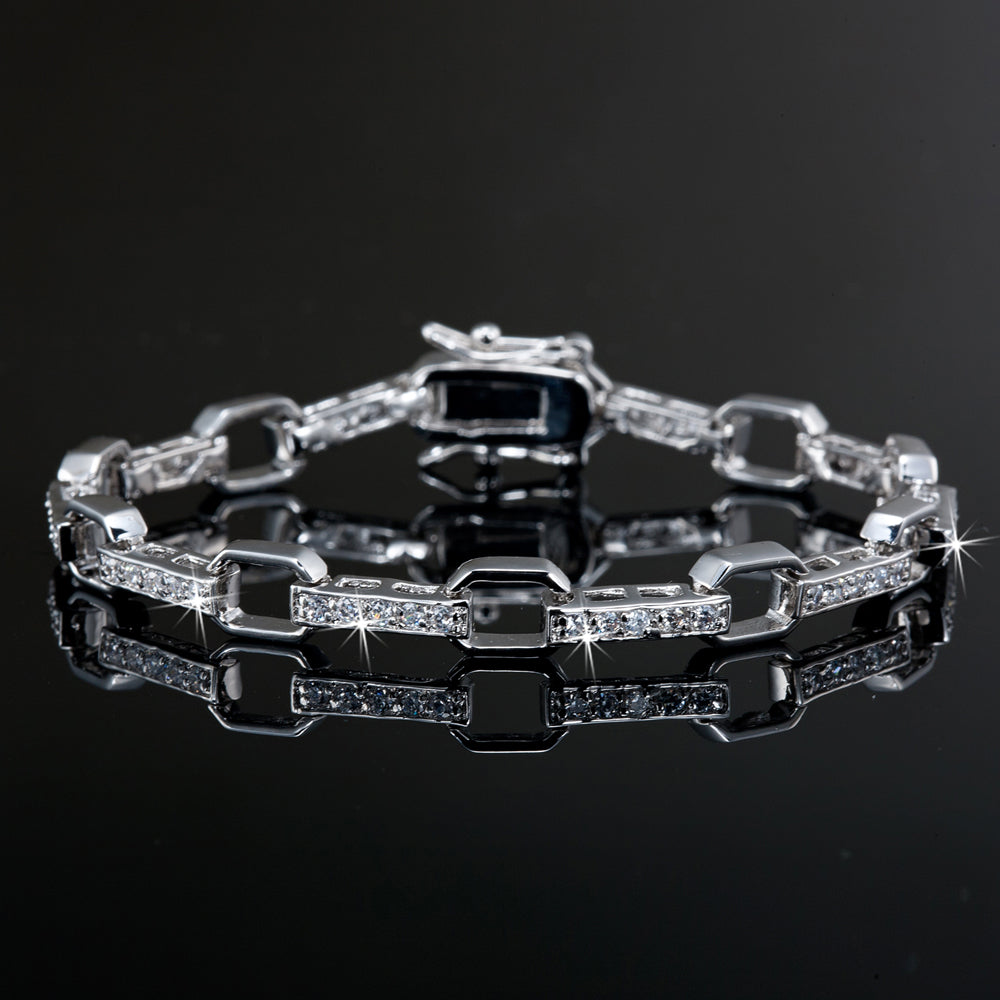 A stunning 925 sterling silver heavy plated tennis bracelet adorned with 50 sparkling Swarovski crystals, showcasing elegance and luxury.