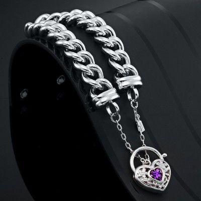 A 925 Sterling Silver Plated Euro Curb Chain Bracelet featuring a purple filigree locket, showcasing its elegant design and quality craftsmanship.
