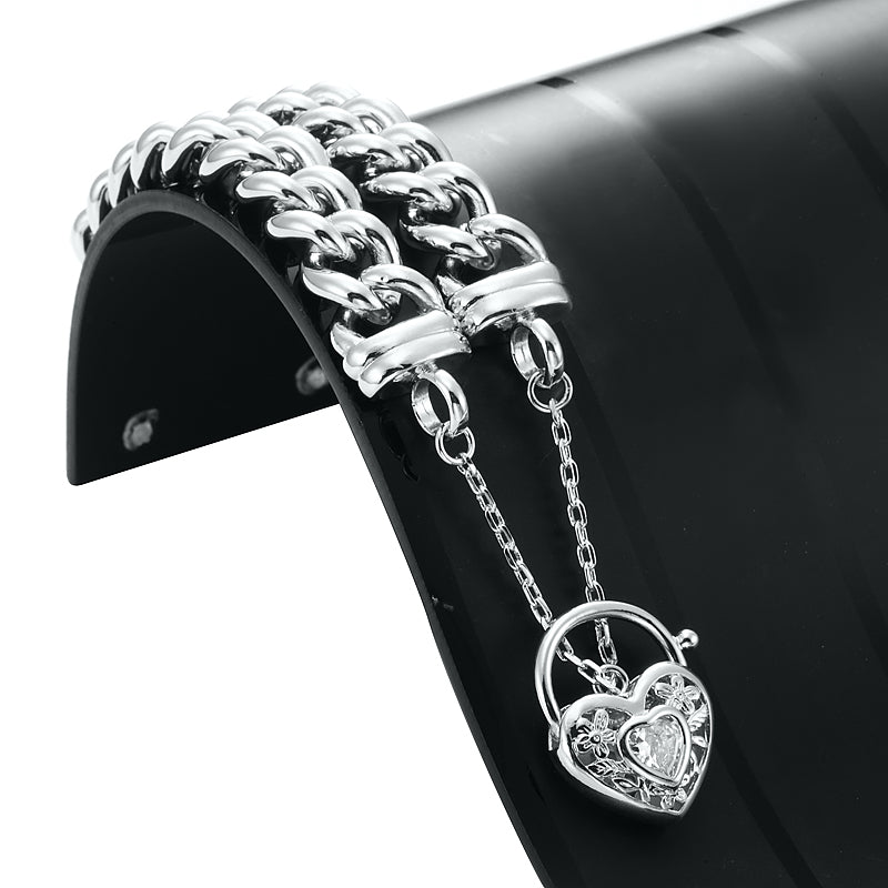 A 925 Sterling Silver Plated Euro Curb Chain Bracelet featuring a filigree locket with a simulated diamond, showcasing its elegant design.