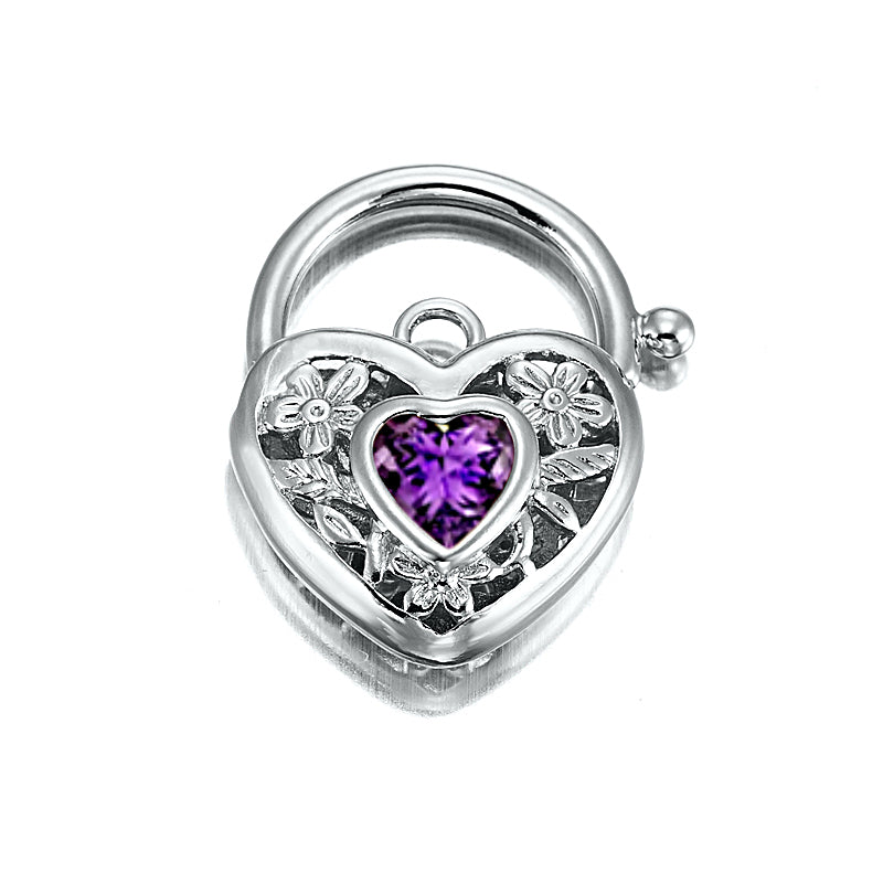 A beautifully crafted 925 Sterling Silver Plated Purple Filigree Heart Locket, showcasing intricate designs and a shiny finish.