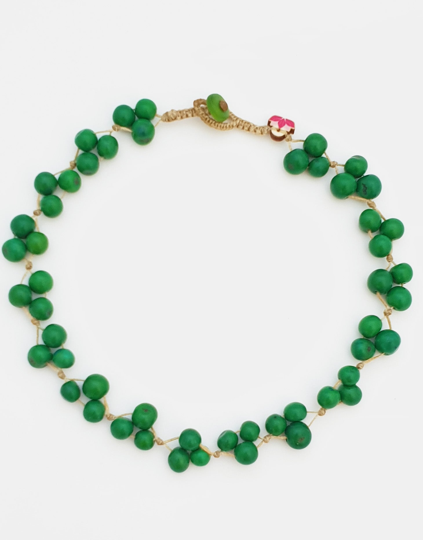 A colorful Acai Berry Short Necklace made from organic acai seeds, showcasing a delicate and lightweight design.