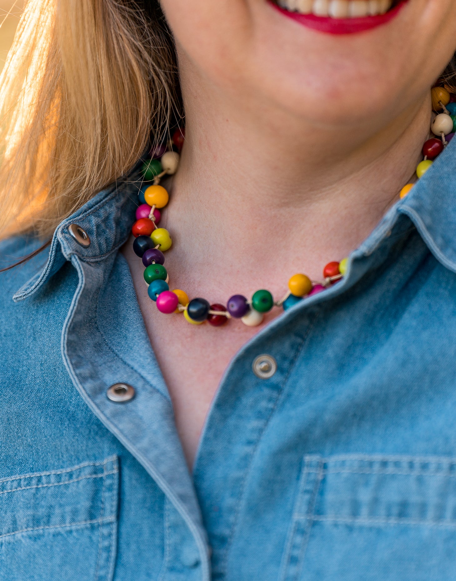 A colorful Acai Berry Short Necklace made from organic acai seeds, showcasing a delicate and lightweight design.