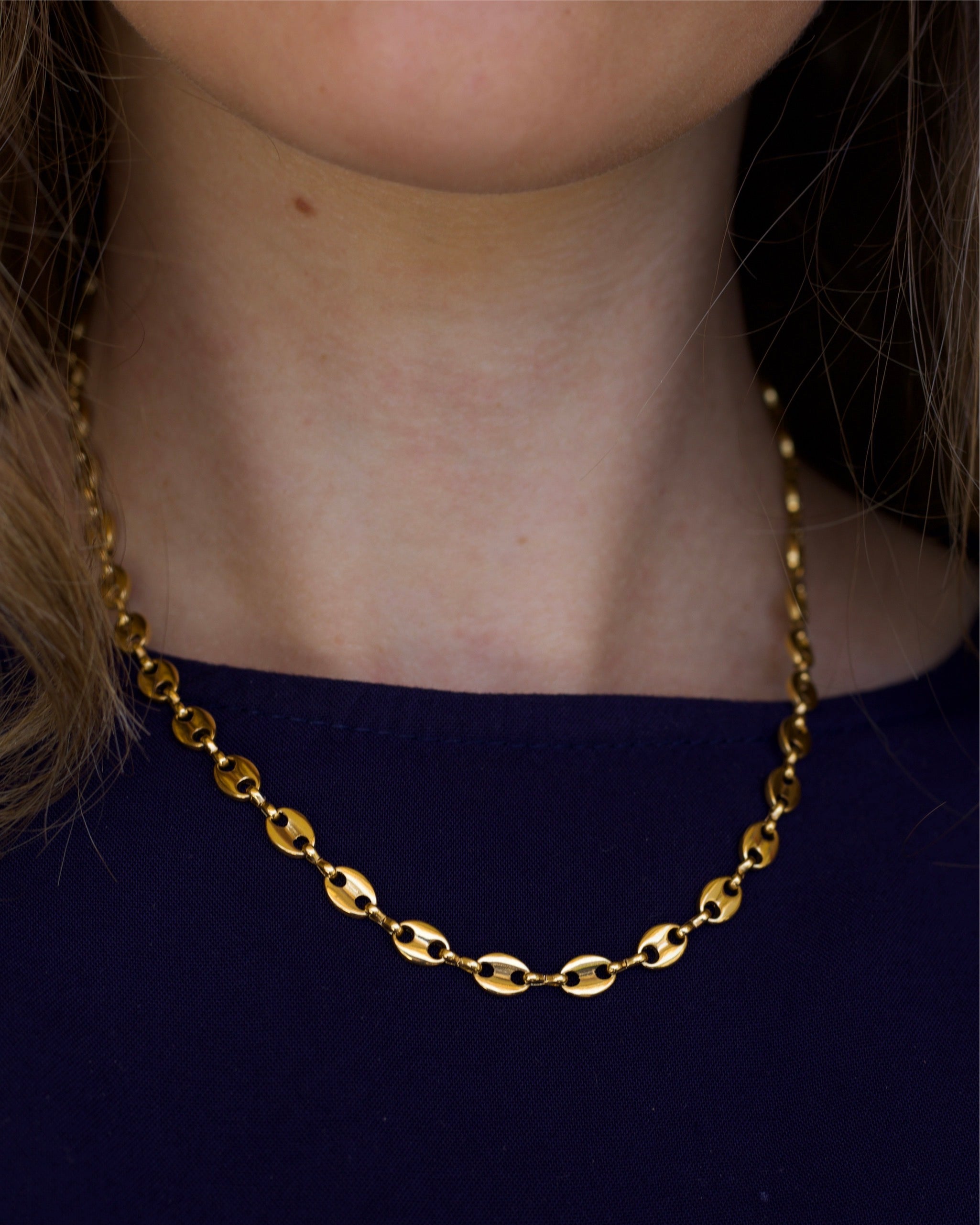 Achaz Coffee Bean Necklace featuring a delicate gold design on stainless steel, perfect for layering or solo wear.