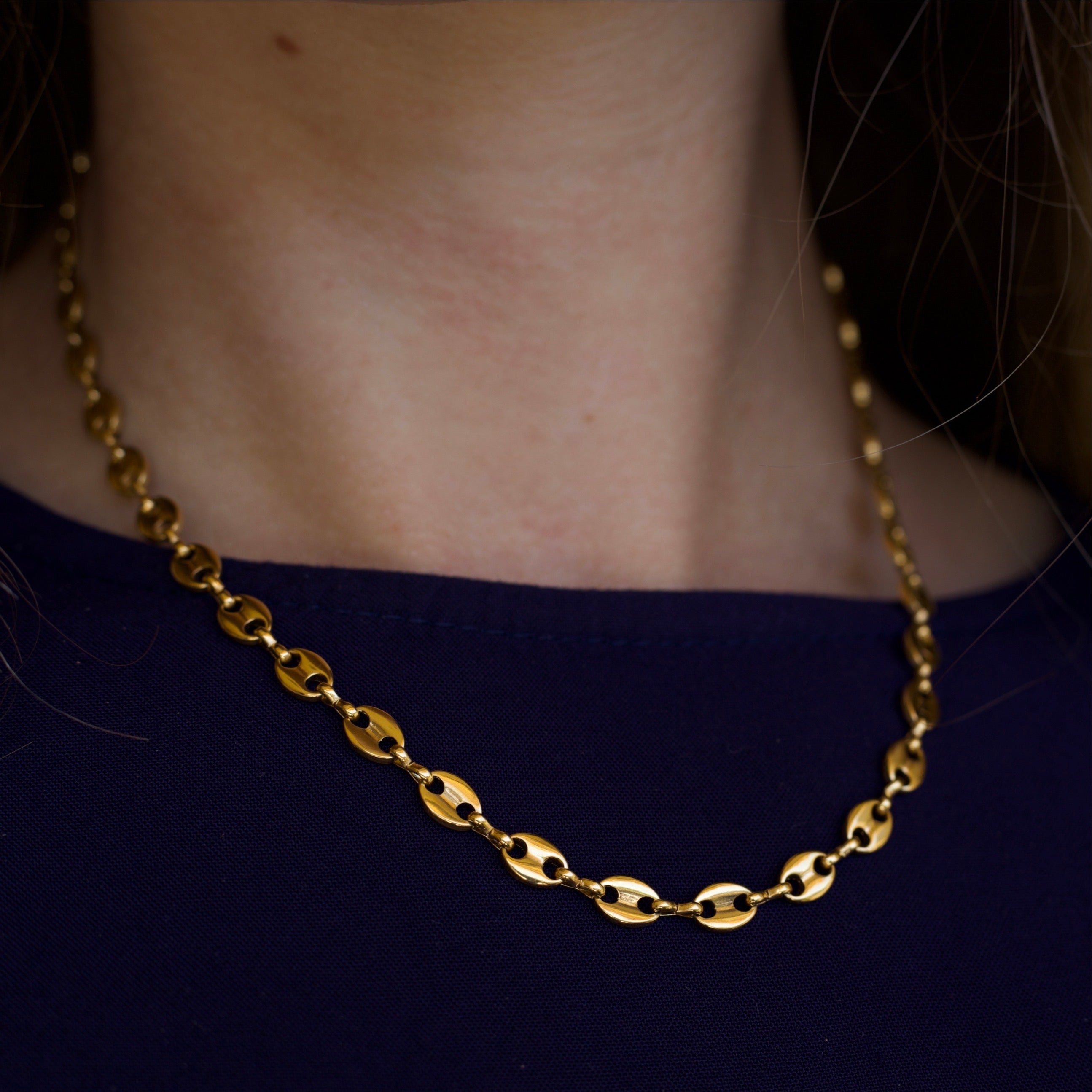 Achaz Coffee Bean Necklace featuring a delicate gold design on stainless steel, perfect for layering or solo wear.