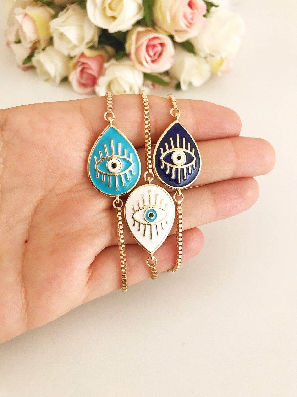 Adjustable Evil Eye Bracelet featuring blue and white evil eye charm on a stainless steel band, showcasing its elegant design and adjustable feature.