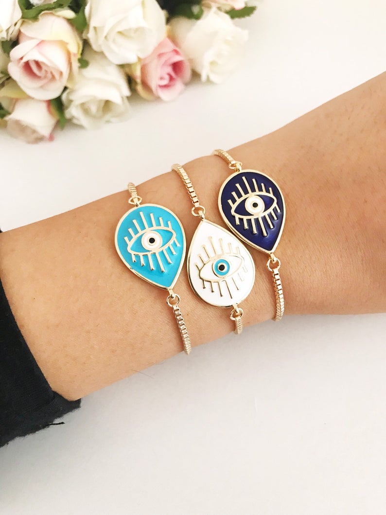 Adjustable Evil Eye Bracelet featuring blue and white evil eye charm on a stainless steel band, showcasing its elegant design and adjustable feature.