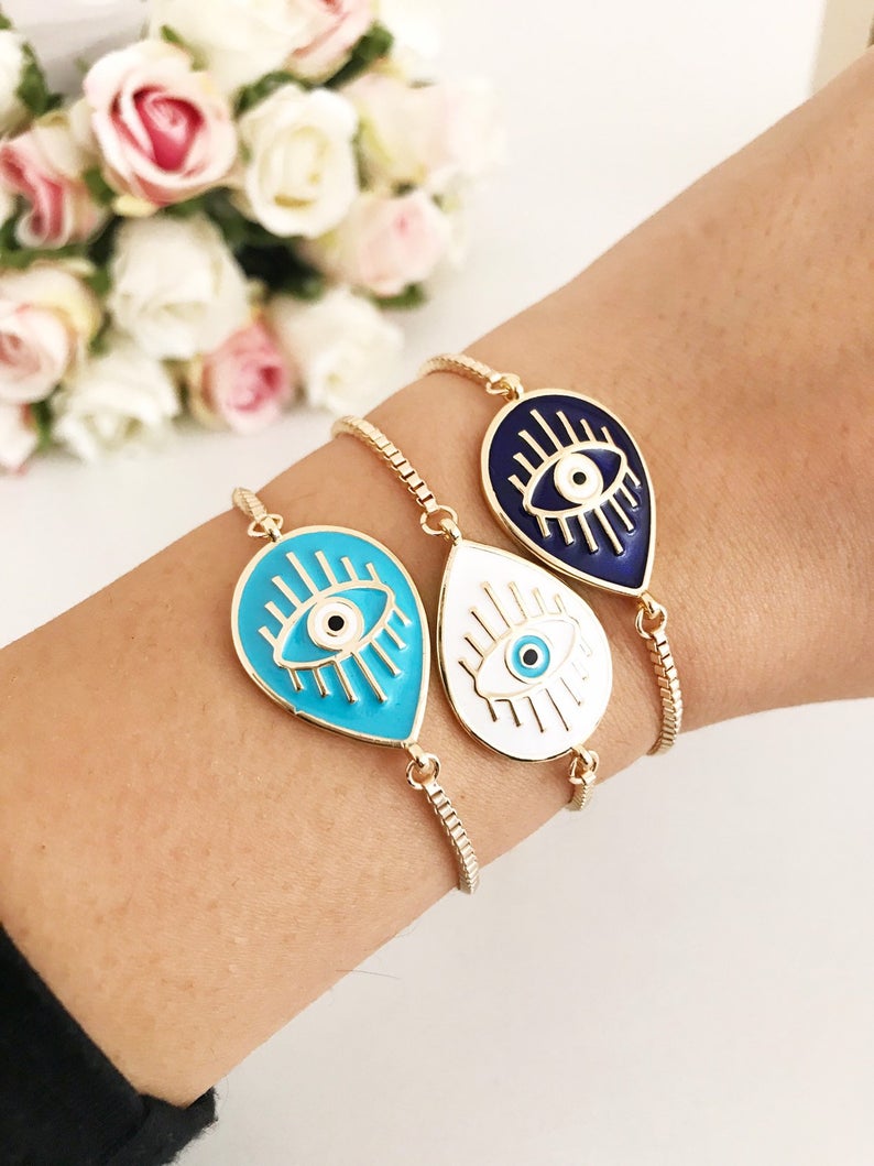 Adjustable Evil Eye Bracelet featuring blue and white evil eye charm on a stainless steel band, showcasing its elegant design and adjustable feature.