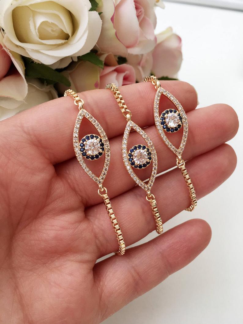 Adjustable Evil Eye Bracelet in rose gold with zircon charm, showcasing its elegant design and adjustable feature.